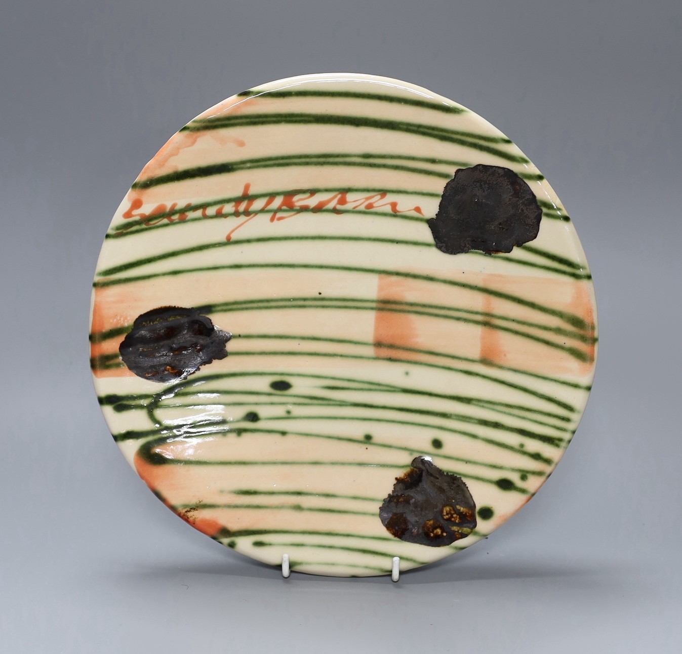 A Sandy Brown glazed pottery dish, signed, 26cm